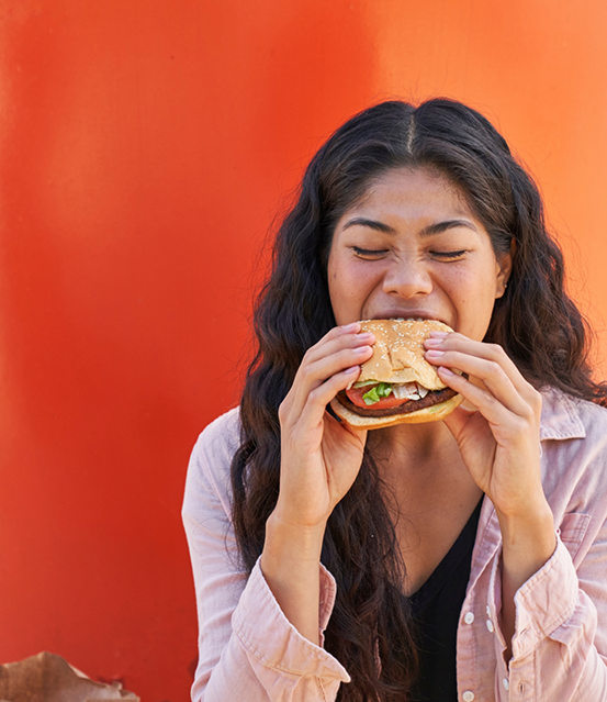 Woman eating a burger
