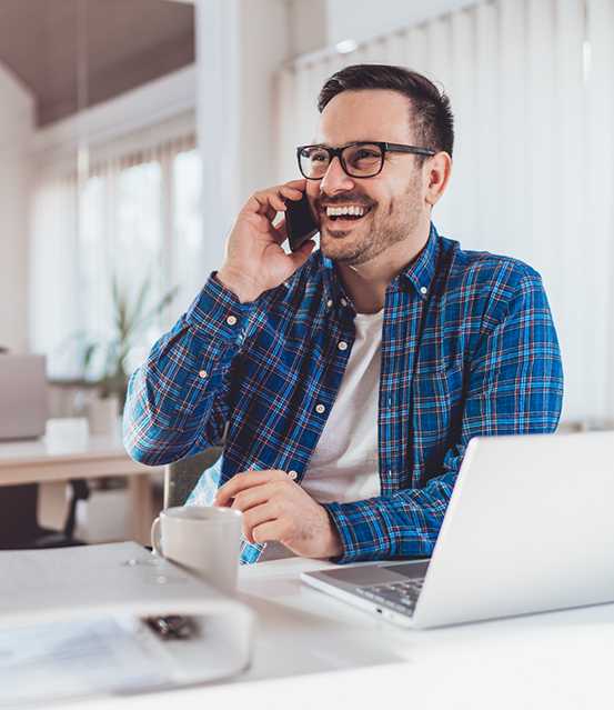 Smiling man tlaking on the phone