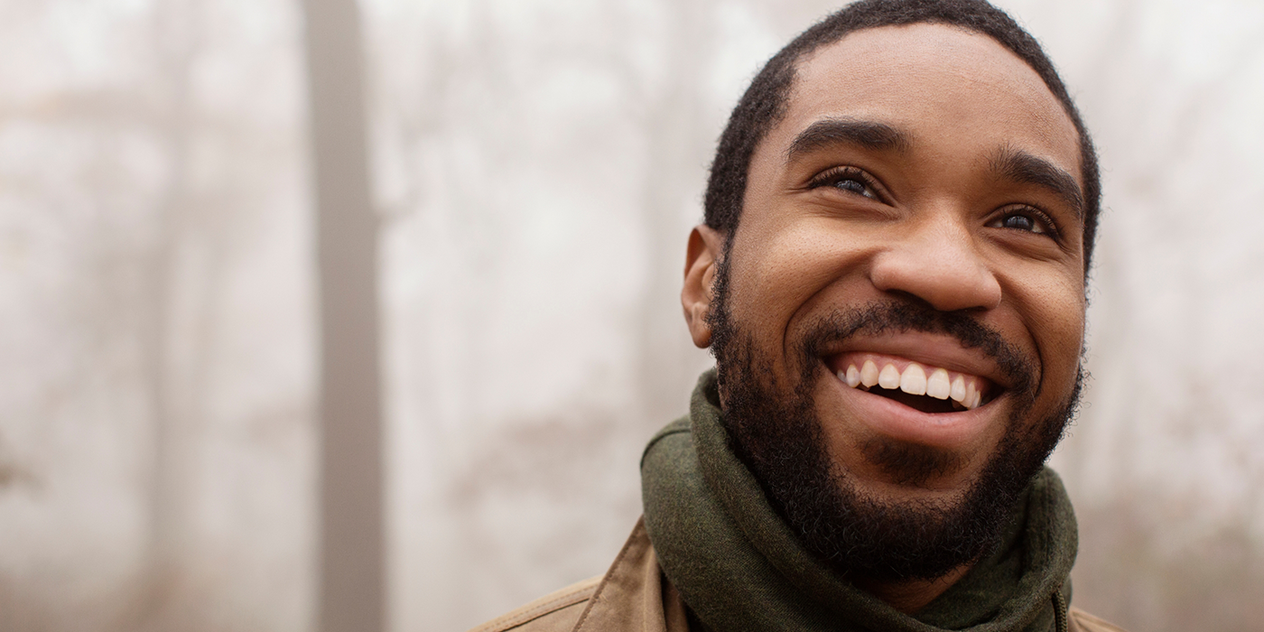 Man smiling brightly after cosmetic dentistry in Fort Worth