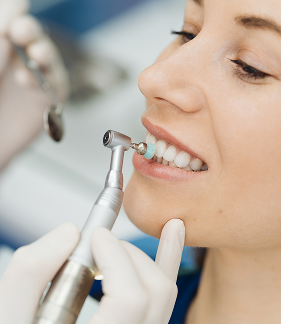 Woman receiving a professional teeth cleaning