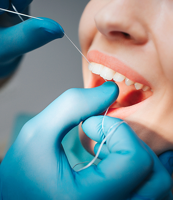 Close up of a dental patient getting their teeth cleaned