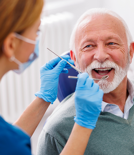 Senior man getting a dental exam
