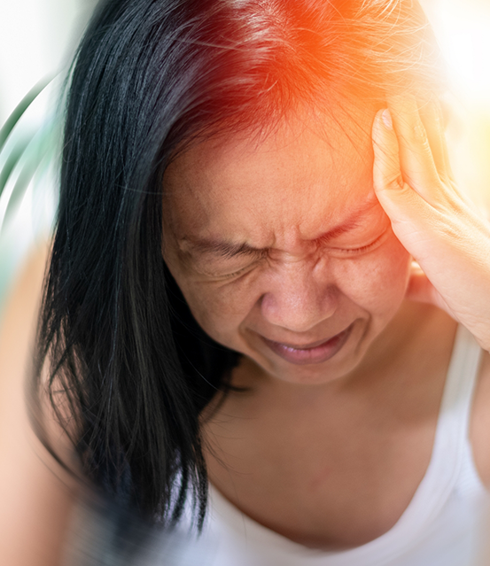 Woman holding her head in pain