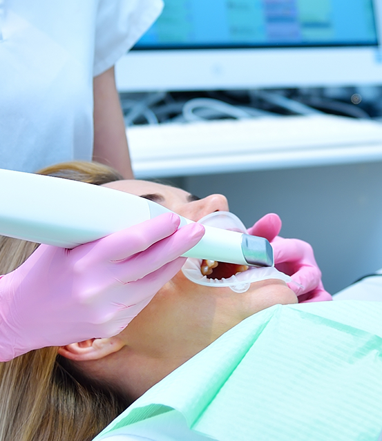 Dental patient having their teeth scanned