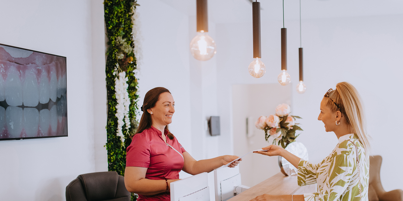 Woman checking in at a dental office in Fort Worth