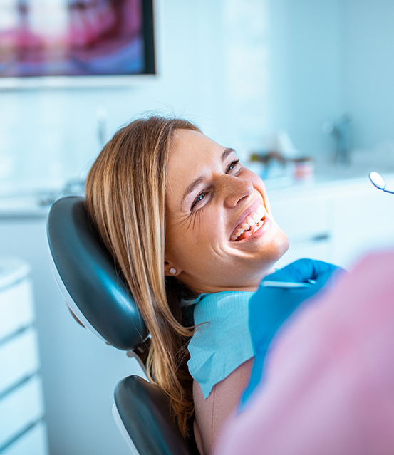 Woman smiling in the dental chair