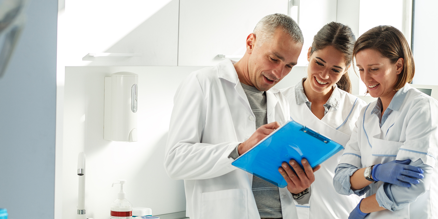 Three dentists having a discussion
