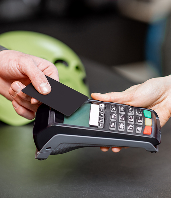 Person swiping their payment card