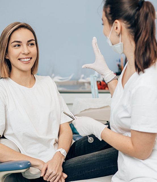 Smiling woman listening to her dentist