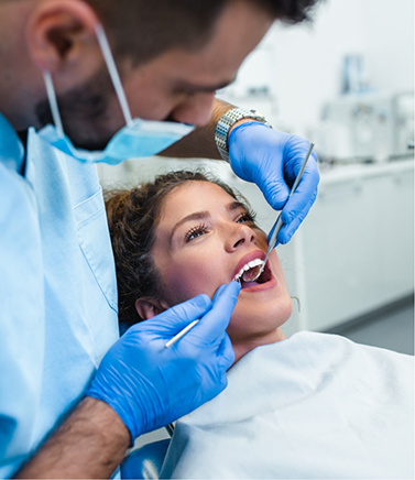 Woman getting an exam from her dentist