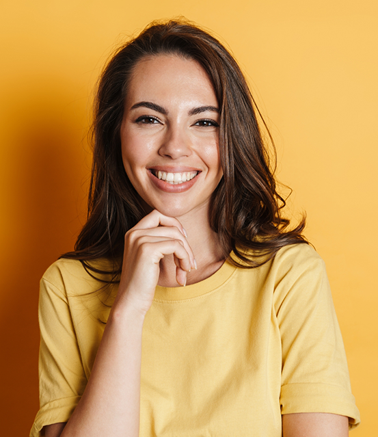 Smiling woman in a yellow shirt