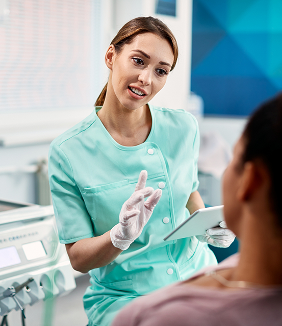 Dentist talking to a patient