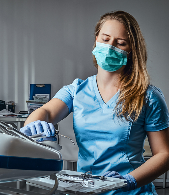 Dentist preparing for a tooth extraction