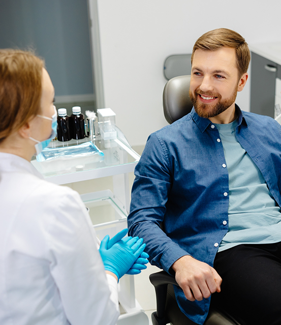 Smiling man listening to his dentist